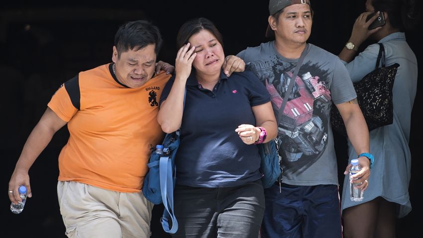 Relatives of a victim cry outside the Resorts World Hotel in Manila on June 2, 2017.
A masked gunman set fire to a gaming room at a casino in the Philippine capital on June 1, igniting a toxic blaze that killed 36 people, authorities said, but they insisted it was not a terrorist attack. / AFP PHOTO / RODY        (Photo credit should read RODY/AFP/Getty Images)
