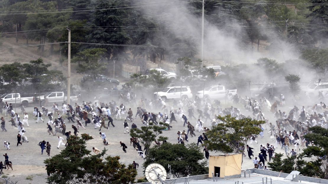 People run for safety after an explosion during the June 3 funeral for a man killed a day earlier in anti-government protests.