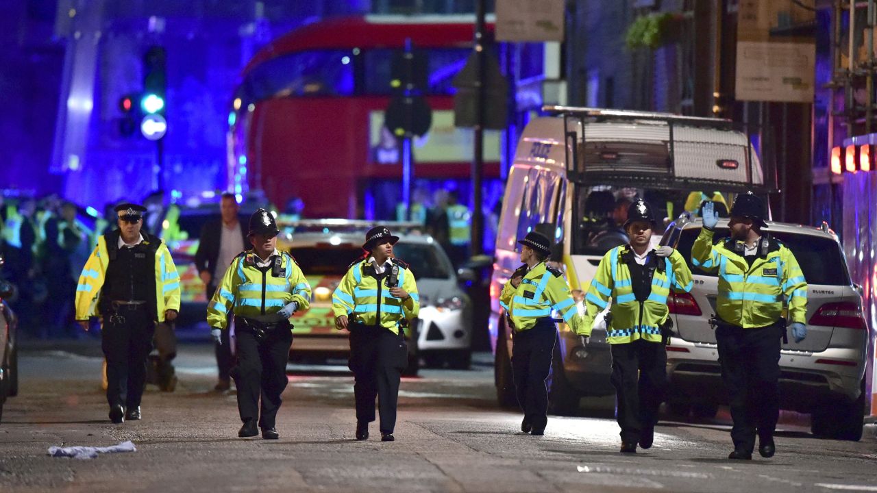 Police officers on Borough High Street as police are dealing with an incident on London Bridge in London, Saturday, June 3, 2017. Witnesses reported a vehicle hitting pedestrians and injured people on the ground. (Dominic Lipinski/PA via AP)