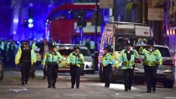 Police officers on Borough High Street as police are dealing with an incident on London Bridge in London, Saturday, June 3, 2017.    Witnesses reported a vehicle hitting pedestrians and injured people on the ground. (Dominic Lipinski/PA via AP)