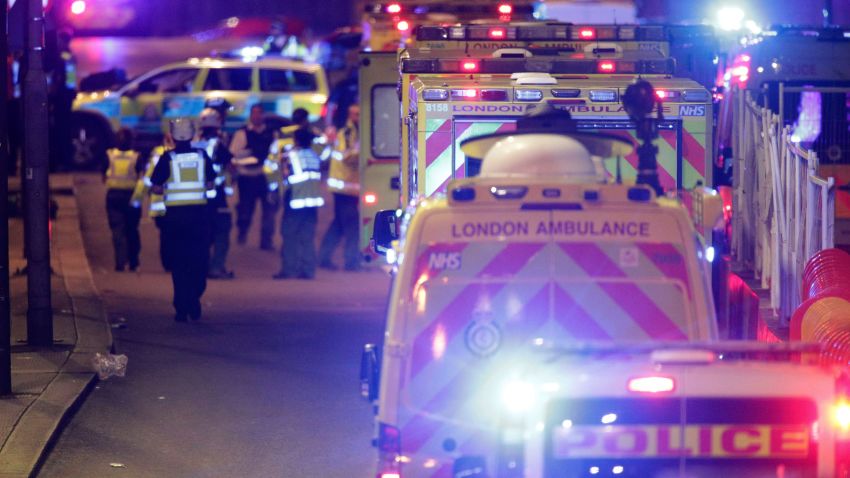 Emergency personnel on London Bridge after an incident in central London, Saturday, June 3, 2017. British police said they were dealing with "incidents" on London Bridge and nearby Borough Market in the heart of the British capital Saturday, as witnesses reported a vehicle veering off the road and hitting several pedestrians. (Dominic Lipinski/PA via AP)