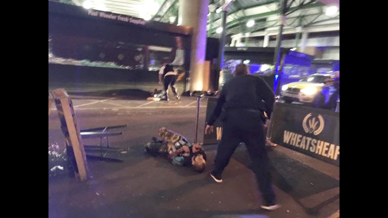 This image, from London's Borough Market, shows two of the attackers after they were shot by London police. The attackers drove a white van into pedestrians on London Bridge, leaving bodies lying in the roadway, a witness to the incident <a href="index.php?page=&url=http%3A%2F%2Fus.cnn.com%2F2017%2F06%2F03%2Feurope%2Flondon-bridge-incident%2Findex.html" target="_blank">told CNN</a>. 
