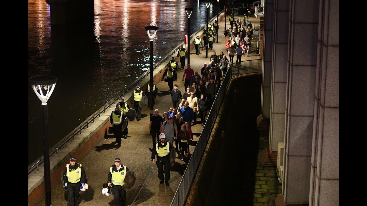 People are lead to safety away from London Bridge.
