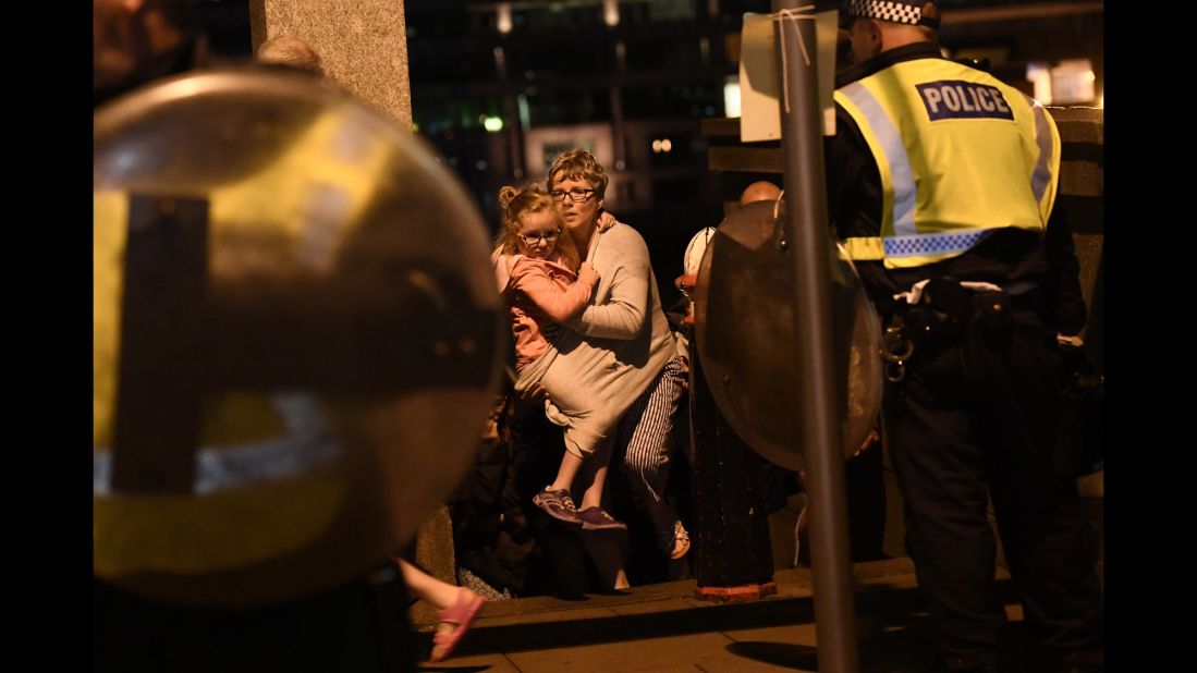 People are led to safety on Southwark Bridge, away from London Bridge.