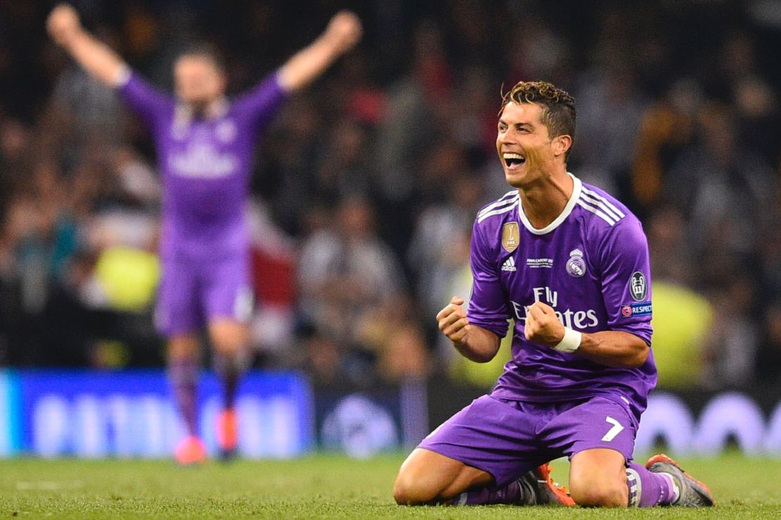 Ronaldo falls to his knees as he celebrates Real's victory in the UEFA Champions League final against Juventus 