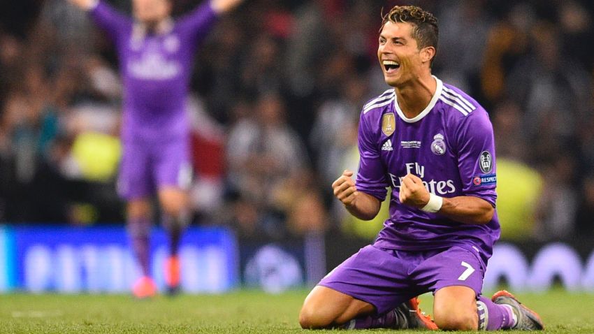 Real Madrid's Portuguese striker Cristiano Ronaldo falls to his knees as he celebrates their victory on the final whistle of the UEFA Champions League final football match between Juventus and Real Madrid at The Principality Stadium in Cardiff, south Wales, on June 3, 2017.
Real Madrid beat Juventus 4-1 to win Champions League. / AFP PHOTO / Glyn KIRK        (Photo credit should read GLYN KIRK/AFP/Getty Images)