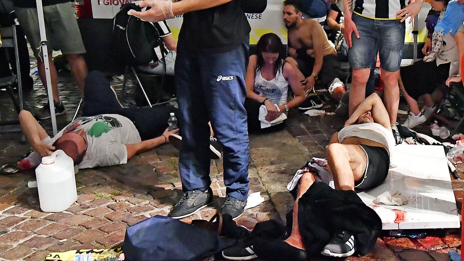 Injured soccer fans in Turin after a stampede at a viewing party.