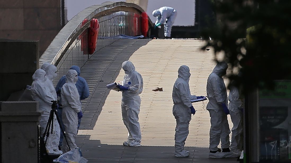 Forensic officers work at the scene of a terror attack at London Bridge in London on Sunday, June 4. At least seven people were killed in attacks late Saturday as a van mowed down pedestrians on London Bridge before attackers then stabbed victims at nearby Borough Market.