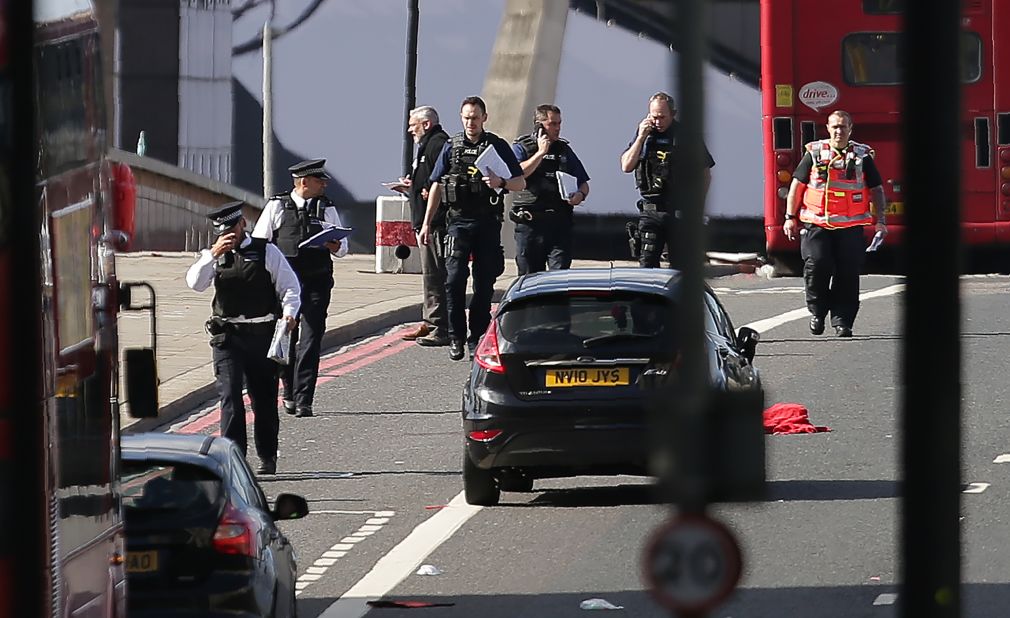 UK police officers on Sunday continue their investigation into the terror attacks on London Bridge and in a nearby restaurant district. The attacks on June 3 came days before a general election and two weeks after 22 people were killed when a suicide bomber targeted an Ariana Grande concert in Manchester.