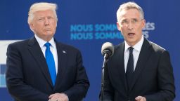NATO Secretary General Jens Stoltenberg (R), flanked by US President Donald Trump, speaks during the unveiling ceremony of the new headquarters of NATO (North Atlantic Treaty Organization) on May 25, 2017 in Brussels during a NATO Summit. 