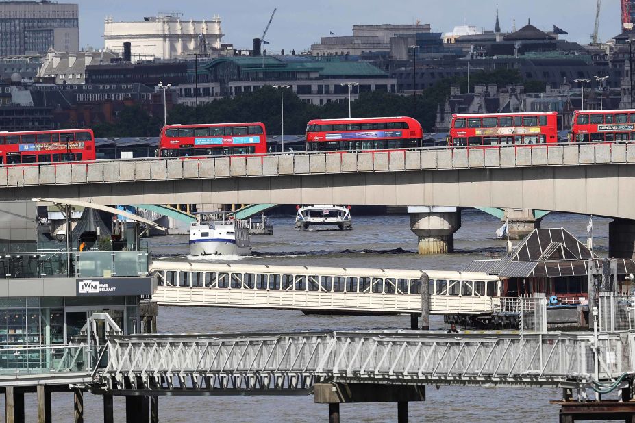 Abandoned buses line London Bridge as the scene remains under investigation following the attack. Metropolitan Police Assistant Commissioner Mark Rowley said in a statement Sunday that a white van struck pedestrians on London Bridge.  Attackers then left the vehicle and "a number of people were stabbed, including an on-duty British Transport Police officer who was responding to the incident at London Bridge," said Rowley. The officer received serious but not life-threatening injuries.