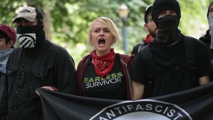 PORTLAND, OR - JUNE 04:  Antifascist demonstrators confront pro-Trump demonstrators during a protest on June 4, 2017 in Portland, Oregon. A protest dubbed "Trump Free Speech" by organizers was met by a large contingent of counter-demonstrators who viewed the protest as a promotion of racism. The demonstrations come in the wake of the recent violent attack on the city's MAX train line when Ricky Best, 53, and Taliesin Namkai-Meche, 23, were stabbed to death and Micah Fletcher, 21, was severely injured after they tried to protect two teenage girls, one of whom was wearing a hijab, from being harassed with racial taunts by suspect Jeremy Christian.  (Photo by Scott Olson/Getty Images)