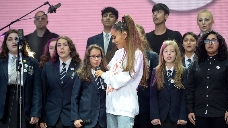 Ariana Grande performs with The Children's Choir.