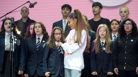 Ariana Grande performs with The Children's Choir. 