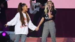 MANCHESTER, ENGLAND - JUNE 04:  NO SALES, free for editorial use. In this handout provided by 'One Love Manchester' benefit concert (L) Ariana Grande and Miley Cyrus perform on stage on June 4, 2017 in Manchester, England. Donate at www.redcross.org.uk/love  (Photo by Getty Images/Dave Hogan for One Love Manchester)
