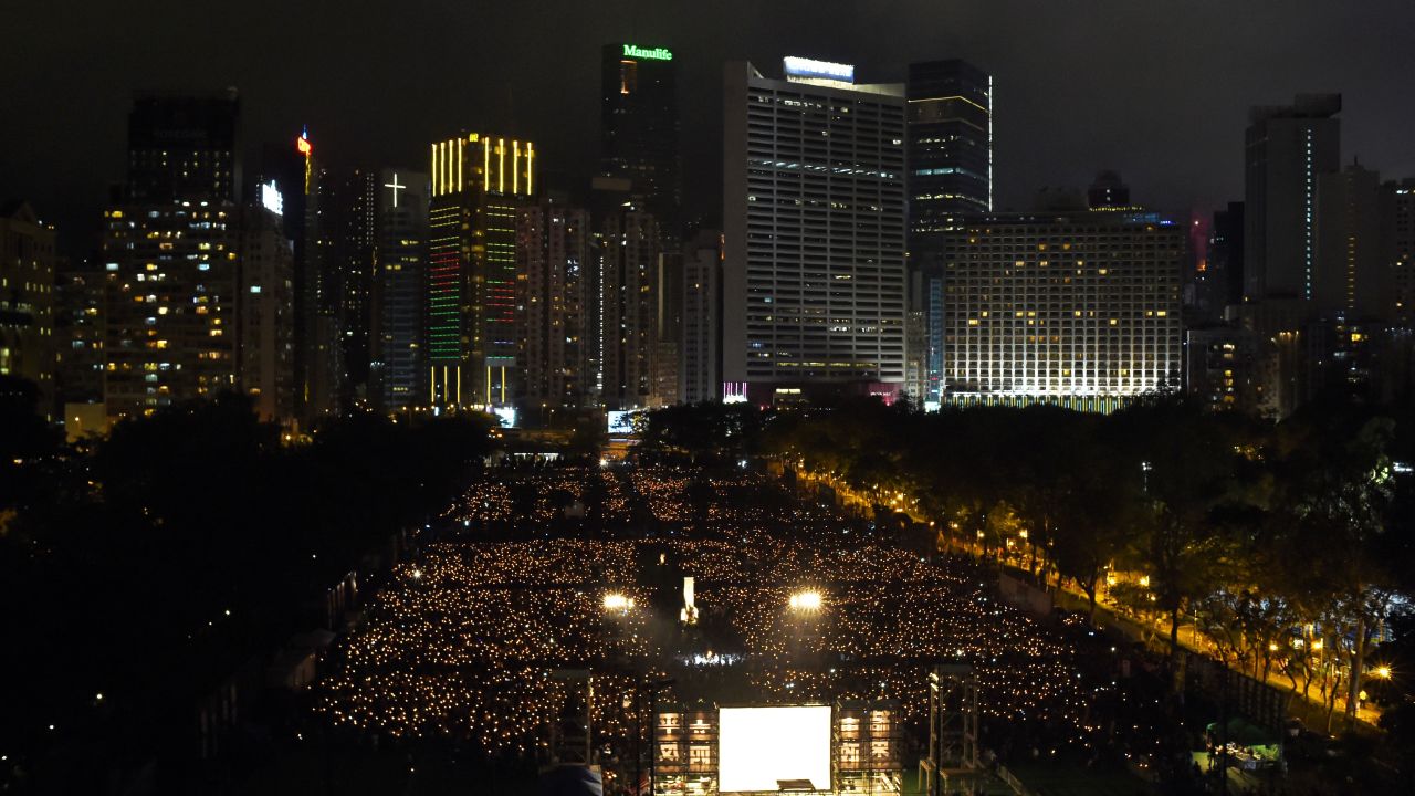 Participants hold candles at Hong Kong's Victoria Park on June 4, 2017, during a candlelight vigil to mark the 28th anniversary of the 1989 Tiananmen crackdown in Beijing. 
