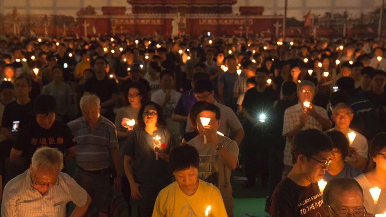 Tens of thousands of people attend an annual candlelight vigil at Hong Kong's Victoria Park, Sunday, June 4, 2017.