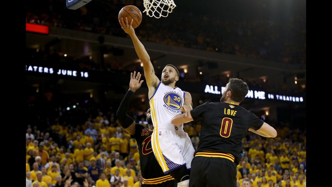 Curry goes up for a layup in Game 2. He also had a triple-double: 32 points, 11 assists and 10 rebounds. 