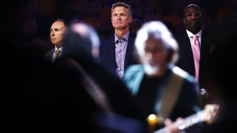 Kerr stands for the national anthem before Game 2. He had just returned to the Warriors bench for the first time since April. He took a leave of absence because of complications from his 2015 back surgery.