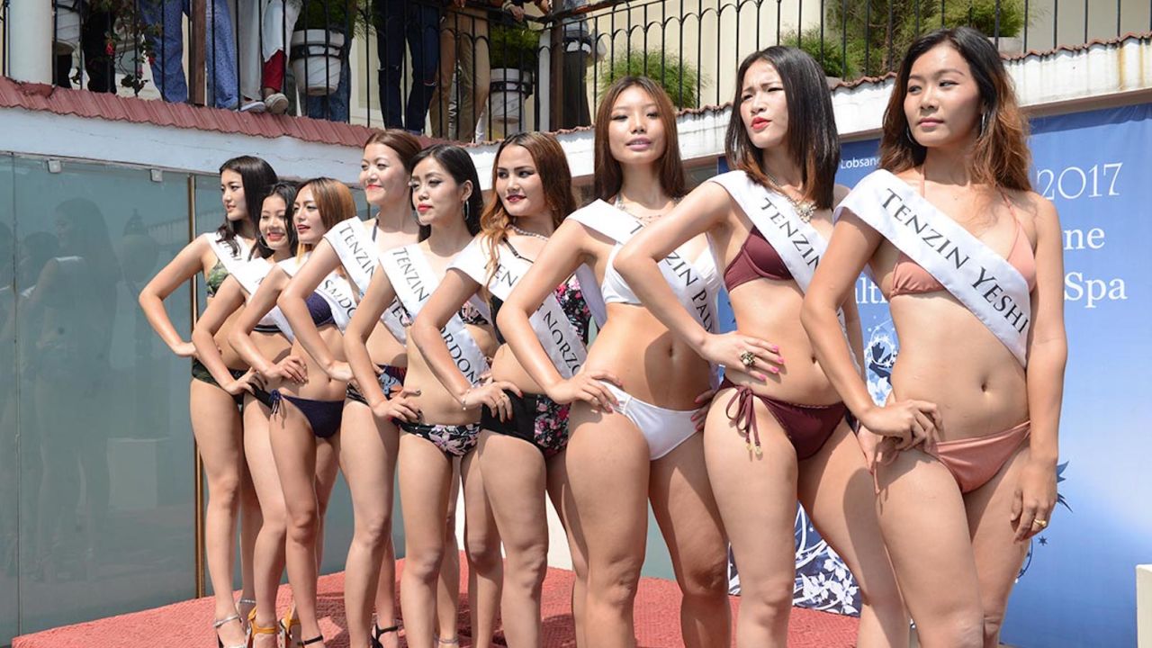 The nine contestants of the Miss Tibet Pageant 2017 pose for a photo during the Swimsuit Round at Asia Health Resorts in Dharamshala, India, on 2 June 2017.