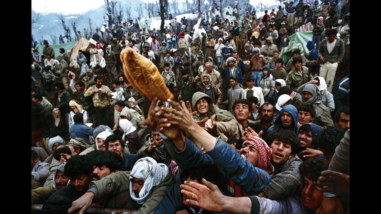 Though the Gulf War came to an end in 1991, internal conflict continued to roil Iraq in the years after and for much of the 25-plus years since. In this April 5, 1992 photo, frantic Kurdish refugees, forced to flee Saddam Hussein's regime, jostle for a loaf of bread during an aid distribution near the Iraqi-Turkish border.