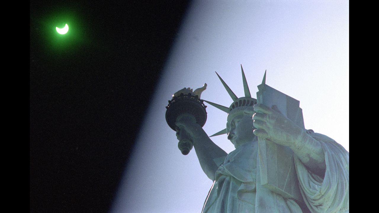 On May 10, 1994, New Yorkers and Lady Liberty were treated to an annular solar eclipse, where the moon appears to block out the sun, apart from a "ring of fire" around the edges of the moon. To get this shot, the photographer held a welder's glass over the lens to protect against the intense light of the sun.