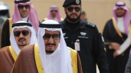 Saudi Arabia's King Salman bin Abdulaziz al-Saud walks across the tarmac to greet US President Donald Trump at King Khalid International Airport in Riyadh on May 20, 2017. / AFP PHOTO / MANDEL NGAN        (Photo credit should read MANDEL NGAN/AFP/Getty Images)