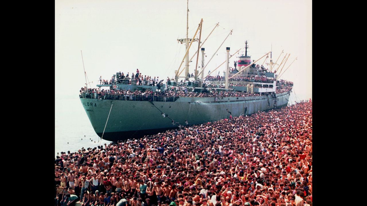 After decades under a Communist regime, Albania pivoted toward democracy under then-President Ramiz Alia. But the transition did not go smoothly, and Alia's government made a swift descent toward anarchy in 1991. Here, thousands of desperate Albanian refugees are shown packed into the harbor of Brindisi in southern Italy, fleeing the chaos at home.