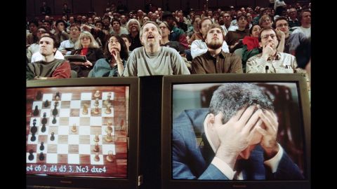 Though considered by many to be the greatest human chess player of all-time, Garry Kasparov found he was no match for his machine rival: IBM's Deep Blue supercomputer. As fans looked on, Kasparov holds his head in his hands at the start of his final match on May 11, 1997, which he lost in 19 moves to give Deep Blue victory in the six-match series.
