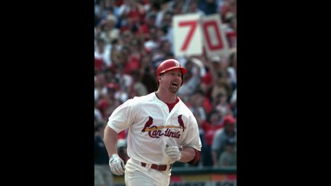 In 1998, baseball fans were treated to a home run race unlike anything the sport had seen, with St. Louis Cardinals slugger Mark McGwire and Chicago Cubs star Sammy Sosa trading long balls all season as they chased Roger Maris' single-season record of 61 home runs. McGwire is shown after belting his 70th and final home run of the 1998 campaign. But his record was broken three seasons later by Barry Bonds, and like many others who played in the so-called "steroid era," McGwire later admitted to using performance-enhancing drugs during the 1998 season.