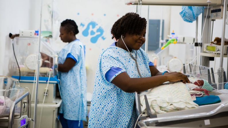 Nurse Thamar Julmiste cares for newborns at Hospital St. Therese in Hinche, Haiti. She's shown here with a boy who was born a day earlier, weighing only 1.7 pounds and not breathing. Julmiste helped resuscitate the infant. 