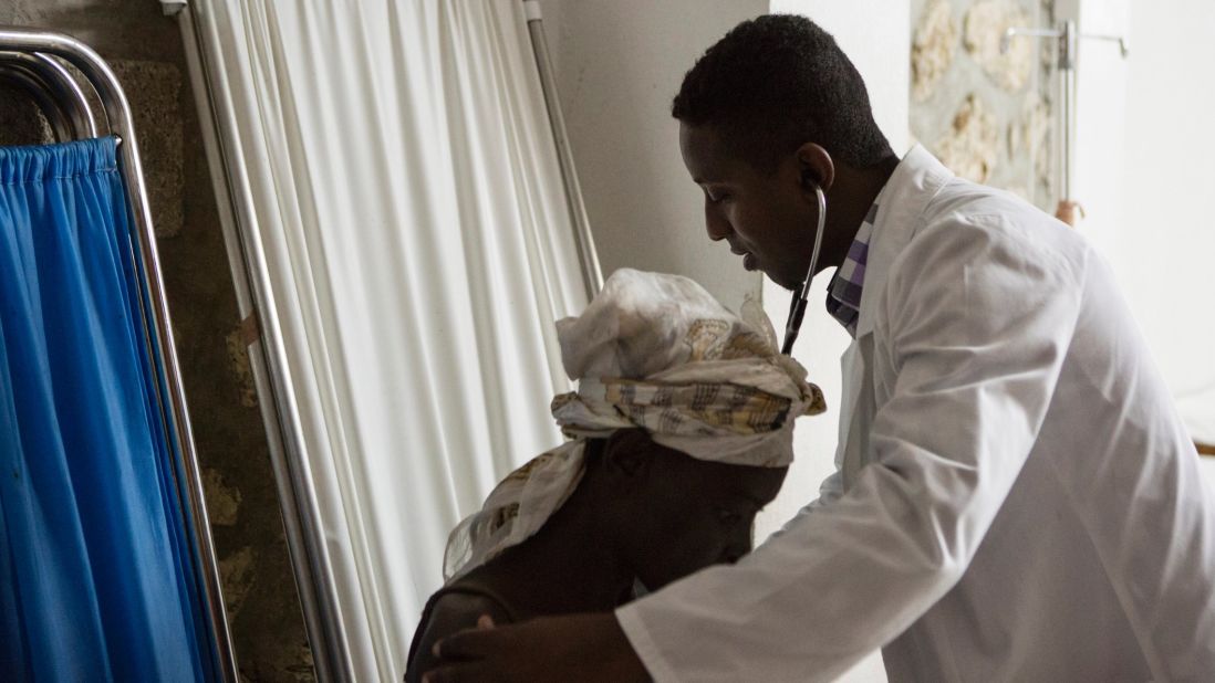 Sauvener checks on Sonya Auguste. University Hospital is a public teaching hospital aimed at increasing Haiti's community of health care professionals. 