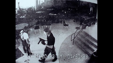 Surveillance tape from Columbine High School on April 20, 1999, shows Eric Harris, left, and Dylan Klebold carrying guns through the school's cafeteria. The two students carried out <a href="http://www.cnn.com/2013/09/18/us/columbine-high-school-shootings-fast-facts/index.html">one of the deadliest school shootings in US history</a>, killing 12 students and one teacher, before turning the guns on themselves in the school's library.