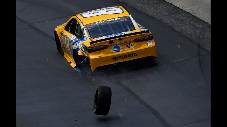 NASCAR driver Kyle Busch loses a tire as he exits pit road during the Cup Series race in Dover, Delaware, on Sunday, June 4.