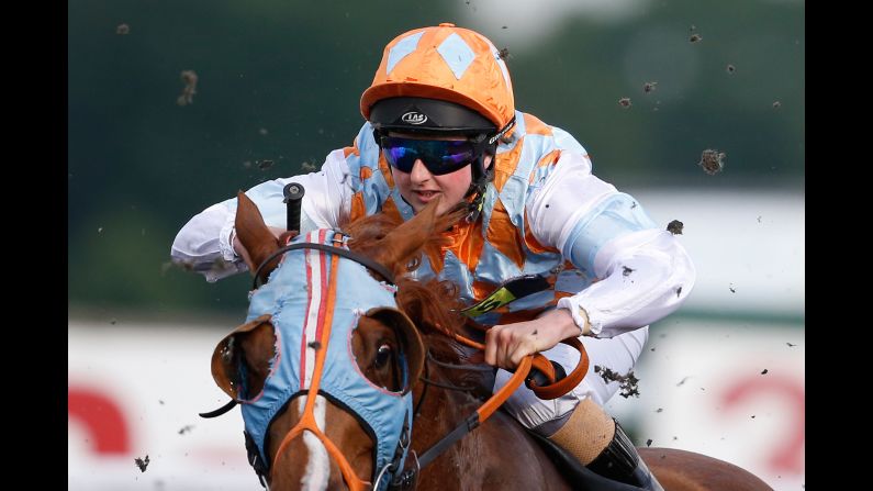 Jockey Gina Mangan rides at Kempton Park Racecourse in Sunbury, England, on Wednesday, May 31.