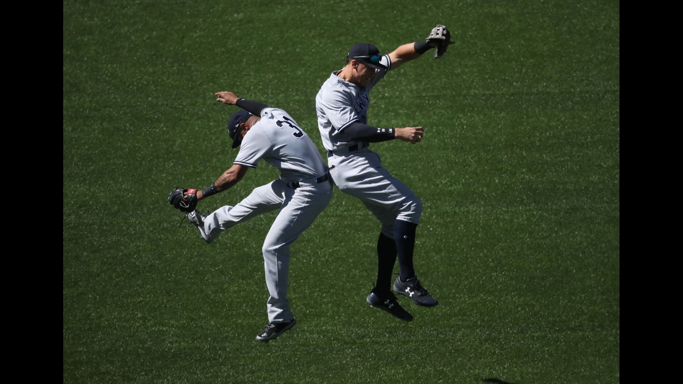 New York Yankees Aaron Hicks, left, and Aaron Judge celebrate a win in Toronto on Saturday, June 3.