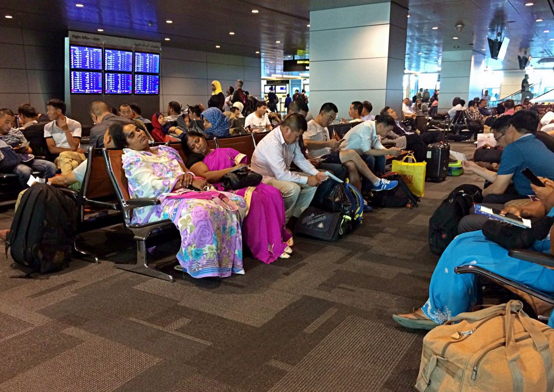 Passengers of cancelled flights wait on Tuesday, June 6, in Hamad International Airport in Doha, Qatar.
