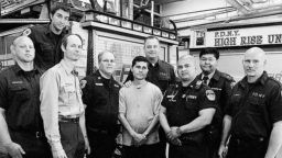 Alcides Moreno (centre) met the New York Fire Department members who rescued him in 2008.