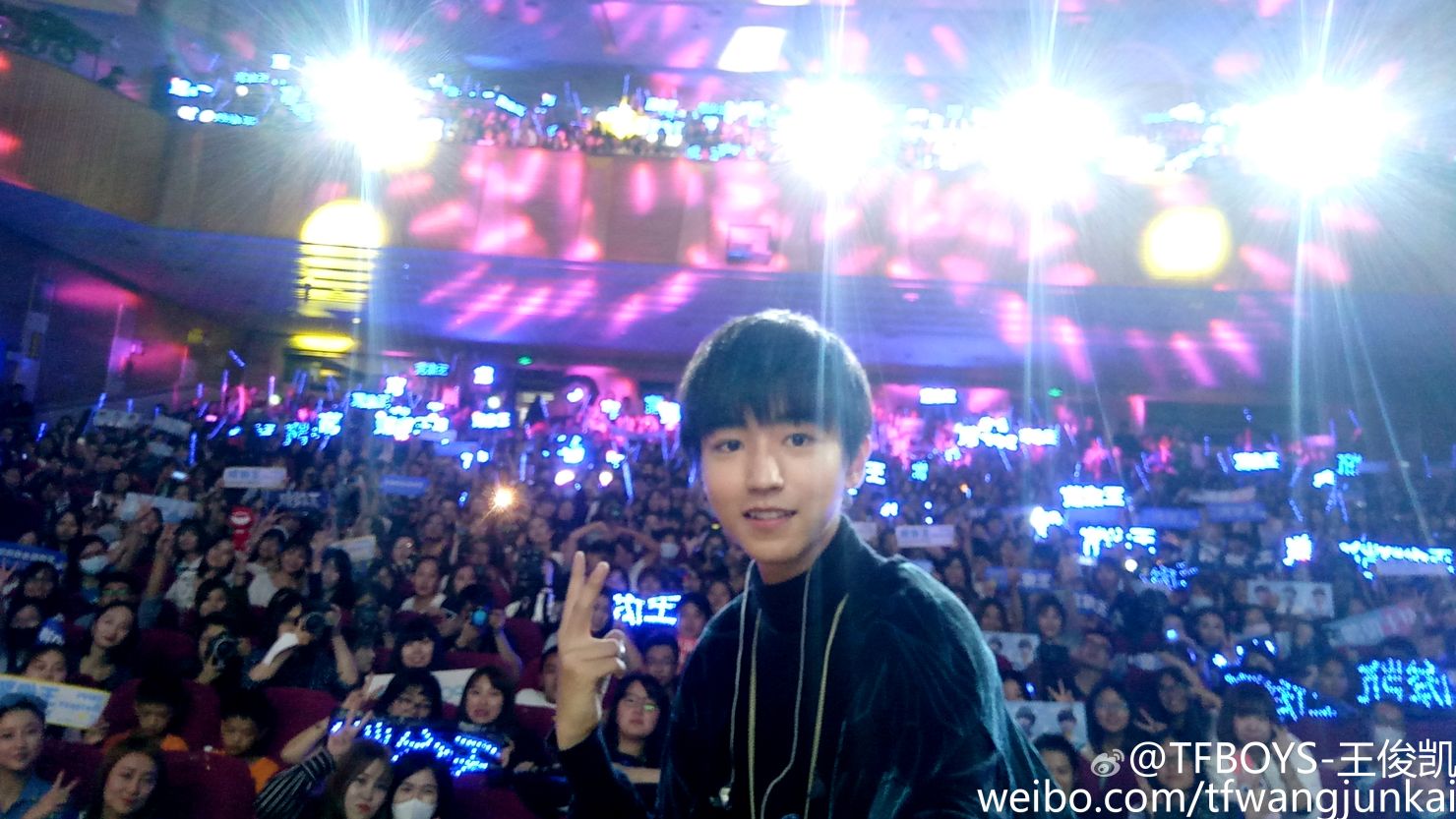 Wang Junkai, lead singer of Chinese boy band TFboys, surrounded by fans during his birthday celebration. 