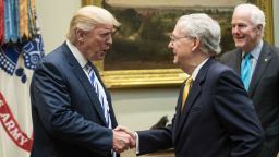 US President Donald Trump shakes hands with Senate Majority Leader Mitch McConnell as he meets with Republican congressional leaders in the Roosevelt Room at the White House in Washington, DC, on June 6, 2017.  (NICHOLAS KAMM/AFP/Getty Images)