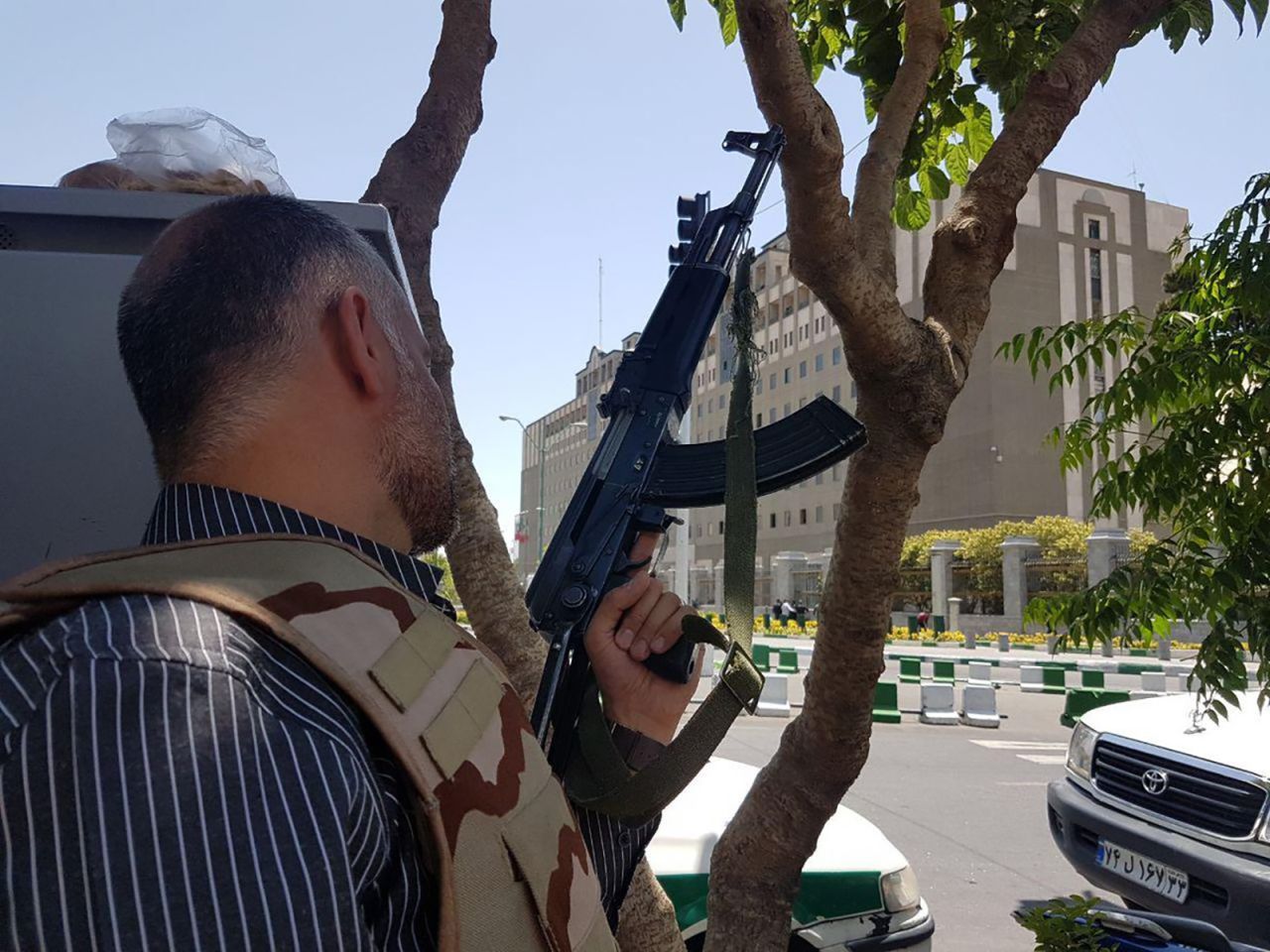 An Iranian security forces officer takes a position Wednesday outside the parliament building in Tehran. 