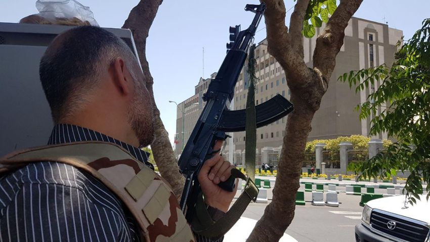 @IranNewspaper - The official daily newspaper of the government of Iran. ++ Images purport to show show one of the attackers looking out from a window, a corpse of one of the attackers, and security services around the building.