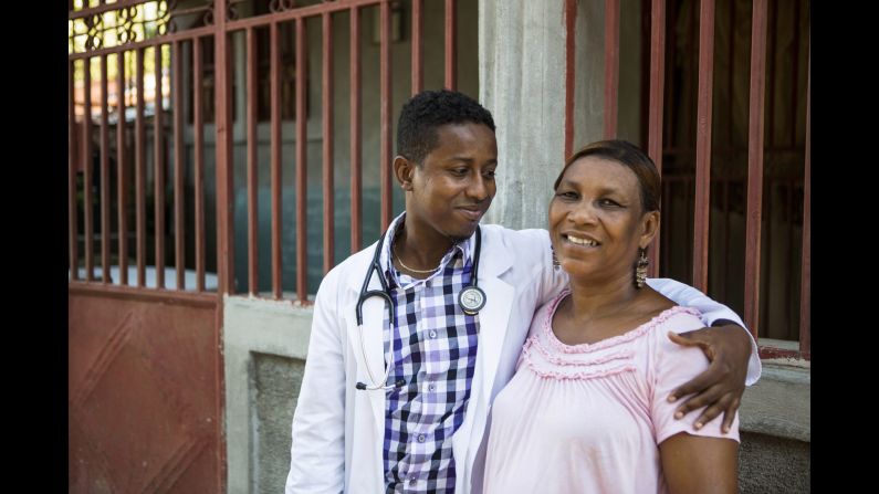 Sauvener shares a moment with his mother, Alourdes Gracia. Their decades-long connection with Farmer and the hospital is a reminder of how their lives have come full circle -- as "Baby" and his colleagues use their skills to help the community.