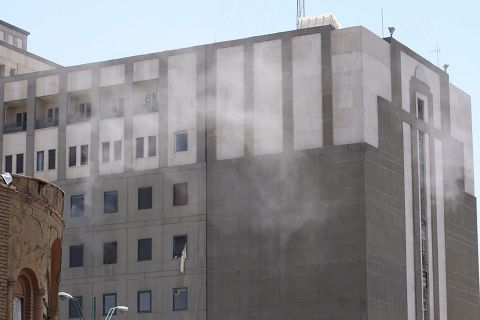 Smoke rises Wednesday from the parliament building in Tehran. Attackers took hostages and detonated at least one suicide bomb. All four attackers were killed by security forces, the semi-official Fars news agency reported.