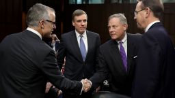 WASHINGTON, DC - JUNE 07:  Senate Intelligence Committee Chairman Richard Burr (R-NC) (2nd R) and ranking member Sen. Mark Warner (D-VA) (2nd L) greet Acting FBI Director Andrew McCabe (L) and Deputy Attorney General Rod Rosenstein before a hearing in the Hart Senate Office Building on Capitol Hill  June 7, 2017 in Washington, DC. The intelligence and security officials testified about re-authorization of Section 702 of the Foreign Intelligence Surveillance Act, which is the law the NSA uses to track emails and phone calls of non-US citizens.  (Photo by Chip Somodevilla/Getty Images)