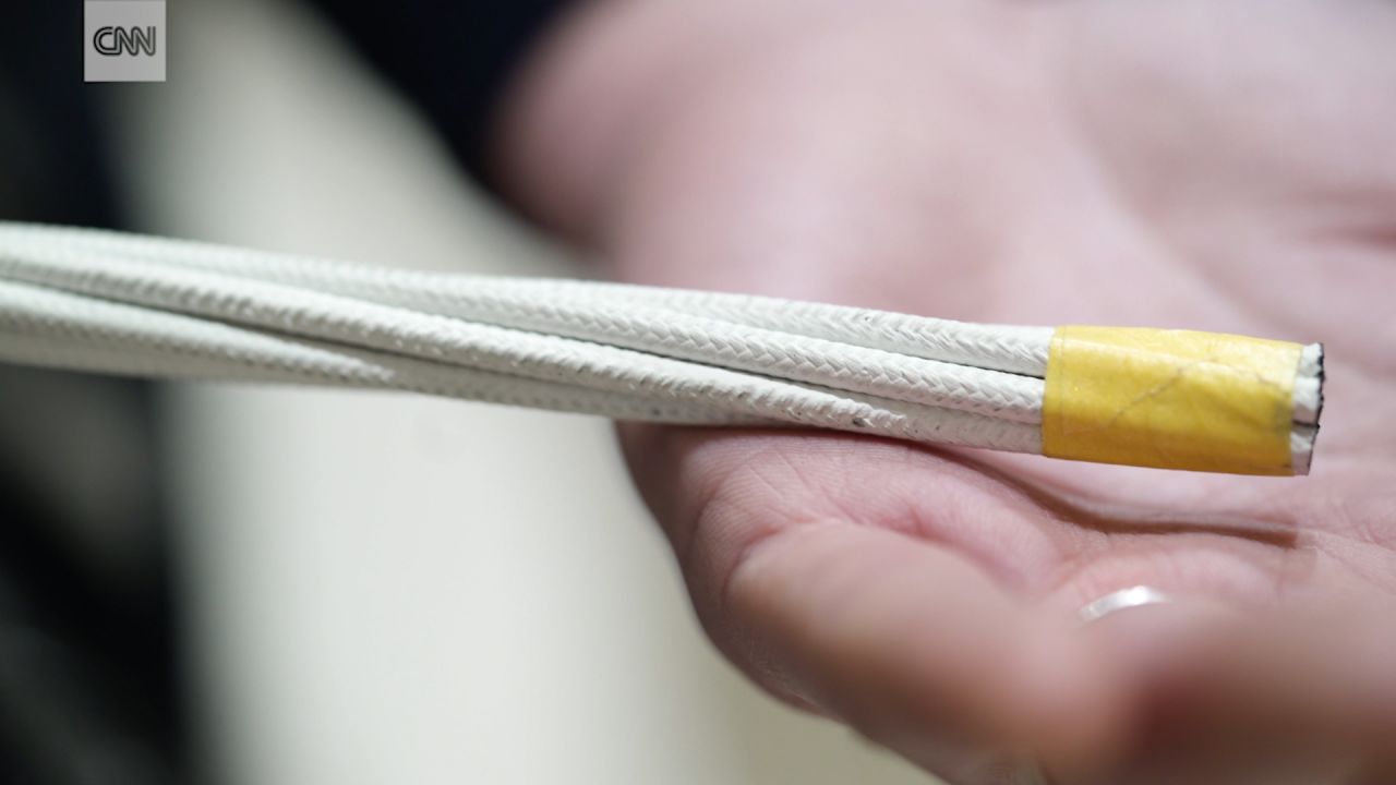 Strands are weaved together and wrapped in thermoplastic resin.