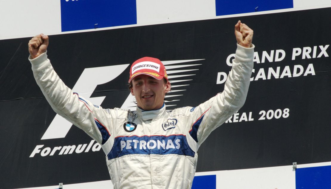 Robert Kubica celebrates on the podium in Montreal after winning the 2008 Canadian Grand Prix.