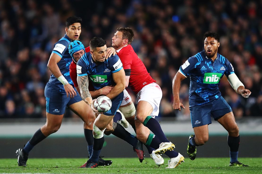 Sonny Bill Williams looks for an offload to unlock the Lions defence.