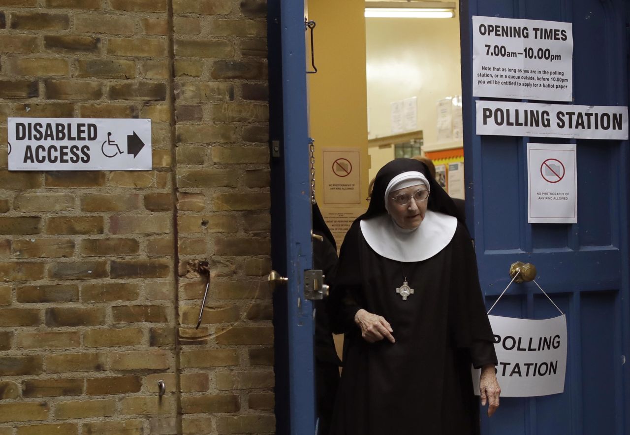 A Benedictine nun leaves a polling station after voting in London.
