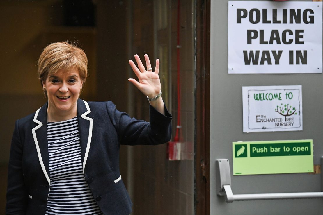 SNP Leader Nicola Sturgeon exits after casting her vote in the general election with her husband Peter Murrel.